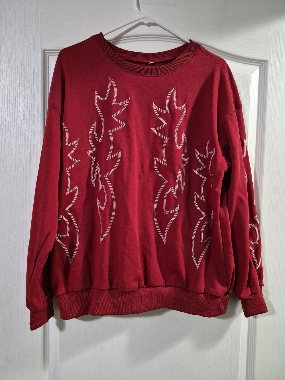 Amazon Women's Red Crewneck Sweatshirt with White Embroidered Flame Accents